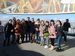 The circular monument with inset Soviet murals overlooks the city.