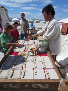 A traditional Mongolian pastime, "Bone games." Using four horse vertebrae, the player rolls his hand and somehow "races them," according to my host at least. I'm still waiting to learn the rules.