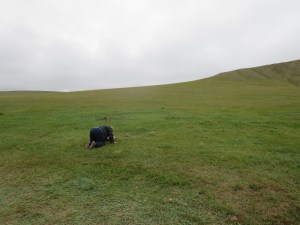 After the camp has been taken down completely, the elders in the family pay their respect to the spirit of the mountain and their ancestors.