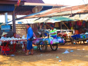 Vendors sell snacks for travelers. After arriving at one small village, sticky rice, roasted chickens, and small beef sticks were thrust into the "song-tu" from all sides by local hawkers! I had no choice but to try the coconut rice (it was practically in my mouth already after being shoved into my face). Roasted in a hollow bamboo stalk it was delicious but too messy to even get a photo!