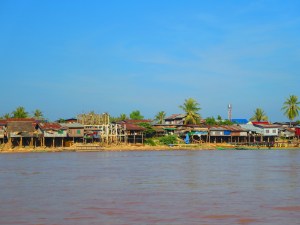 Houses on stilts line the water. In some areas the water level can increase by 2-4 meters along the shore.