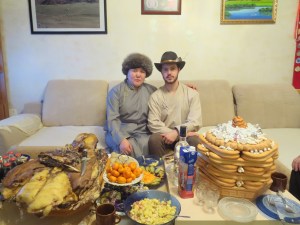 My supervisor and I with the traditional feast set before us! In front you can see the sweet curd dish with raisins along with an array of fruits, small vegetable salads, and juice. The levels of biscuits in the towers displayed at one's household indicate the eldest host's social status. (The highest number 9 is reserved for the President, 7 for eldest grandparents, 5 for younger grandparents, etc.)