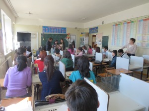 The class watches students give a presentation in my English club.