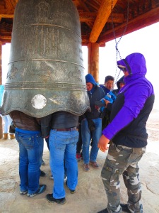 The best spot for the energy is inside the bell. At first I thought these men were just messing around, but it's a ritual!