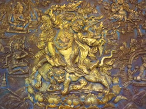 A wrathful deity cast in bronze.