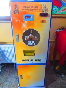 A stupa coin vending machine! What?! For a mere 5,000 tugriks your donation can yield a miraculous collector's item! (Unless the machine eats your money and a monk needs to unplug and re-plug it in for you first...)